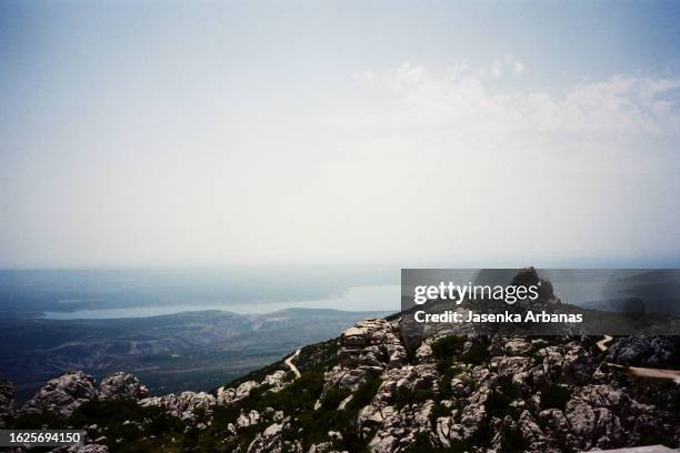 view of landscape of velebit mountain and sea in croatia - zadar croatia stock pictures, royalty-free photos & images