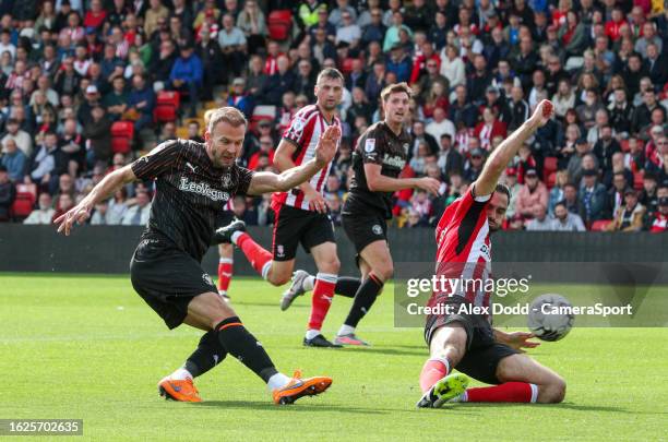 Blackpool's Jordan Rhodes shoots at goal during the Sky Bet League One match between Lincoln City and Blackpool at LNER Stadium on August 26, 2023 in...