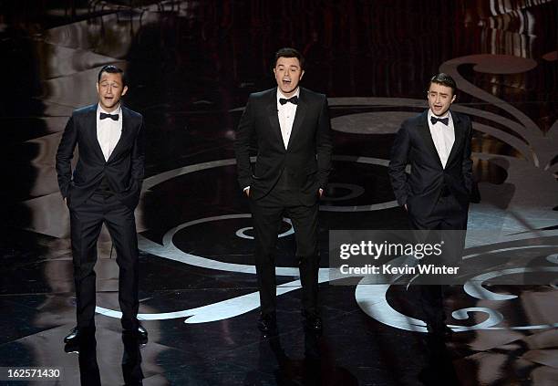 Actor Joseph Gordon-Levitt, host Seth MacFarlane and actor Daniel Radcliffe dance onstage during the Oscars held at the Dolby Theatre on February 24,...
