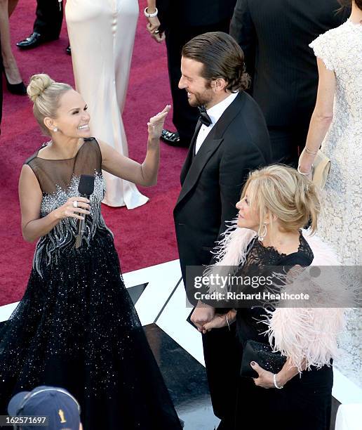 Actress Kristin Chenoweth interviews actor Bradley Cooper at the Oscars held at Hollywood & Highland Center on February 24, 2013 in Hollywood,...