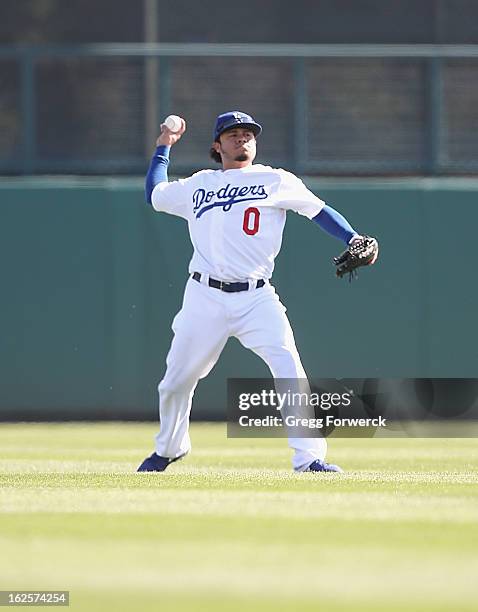 Alfredo Amezaga of the Los Angeles Dodgers throws a ball in from left field during their spring training baseball game against the Chicago White Sox...