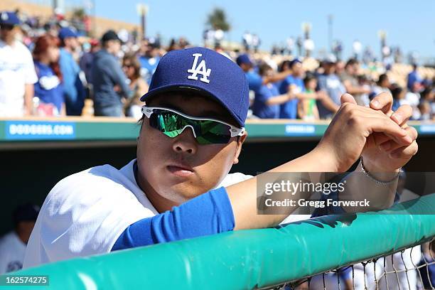 Hyun-Jin Ryu of the Los Angeles Dodgers watches introductions prior to their spring training baseball game against the Chicago White Sox at Camelback...