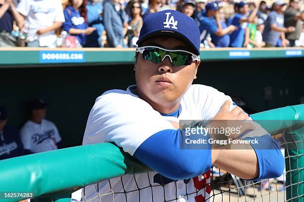 Hyun-Jin Ryu of the Los Angeles Dodgers watches introductions prior to their spring training baseball game against the Chicago White Sox at Camelback...