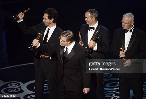 Supervisors Guillaume Rocheron, Bill Westenhofer, Erik-Jan De Boer and Donald R. Elliott accept the Best Visual Effects award for "Life of Pi"...