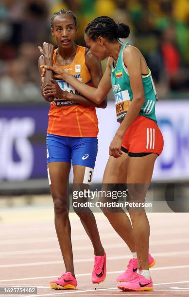Sifan Hassan of Team Netherlands and Letesenbet Gidey of Team Ethiopia react after competing in the Women's 10000m Final during day one of the World...