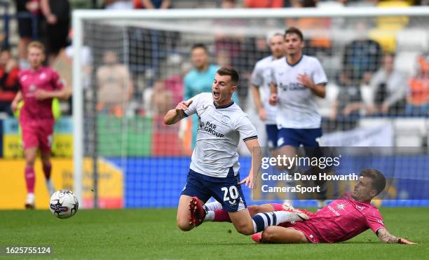 Preston North End's Ben Woodburn is tackled by Swansea City's Jamie Paterson during the Sky Bet Championship match between Preston North End and...