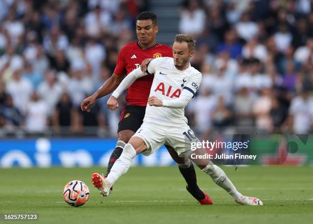 James Maddison of Spurs holds off Casemiro of Man Utd during the Premier League match between Tottenham Hotspur and Manchester United at Tottenham...