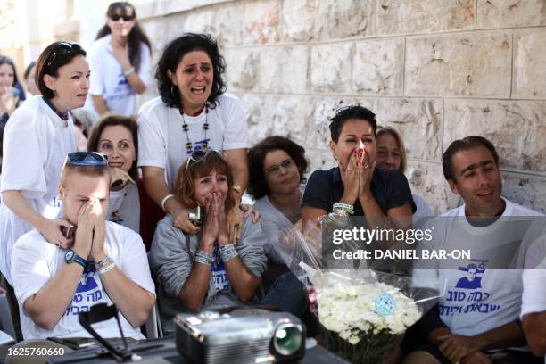 Supporters of abducted Israeli soldier Gilad Shalit celebrate his release on October 18, 2011 at his family's protest tent outside the prime minister...