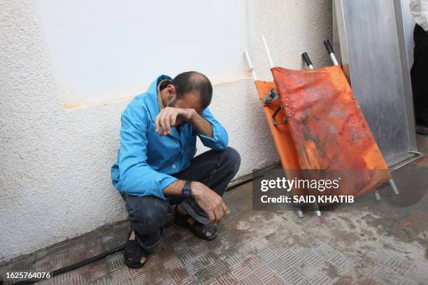 Palestinian man grieves outside the al-Najar hospital in the southern Gaza Strip town of Rafah on October 29 2011, after six Islamic Jihad militants...