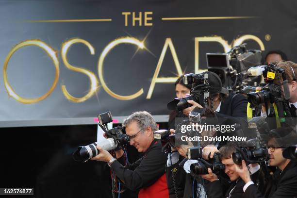 Photographers cover the red carpet arrivals to the 85th Annual Academy Awards at the Hollywood & Highland Center on February 24, 2012 in Hollywood,...