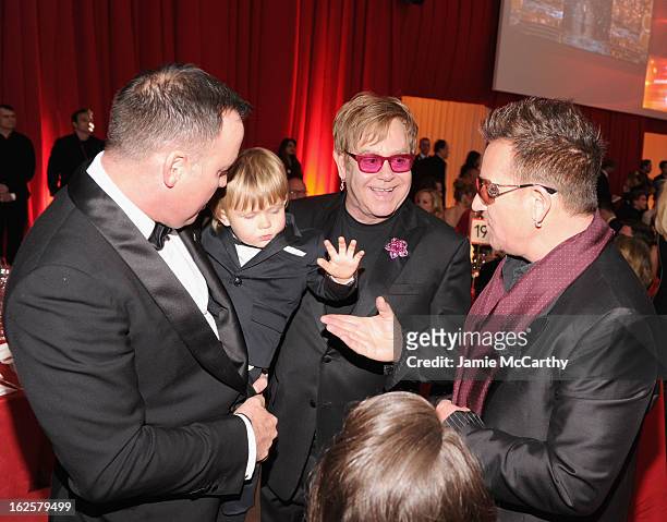 David Furnish, Zachary Furnish-John, Sir Elton John and singer Bono of U2 attend the 21st Annual Elton John AIDS Foundation Academy Awards Viewing...