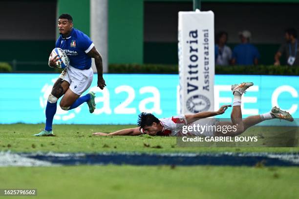 Italy's winger Montanna Ioane runs to score a try during the Rugby union match Italy vs Japan on August 26, 2023 at the Monigo stadium in Treviso as...