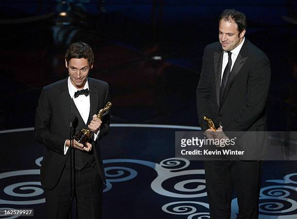 Filmmakers Malik Bendjelloul and Simon Chinn accept the Best Documentary - Feature award for "Searching for Sugar Man" onstage during the Oscars held...