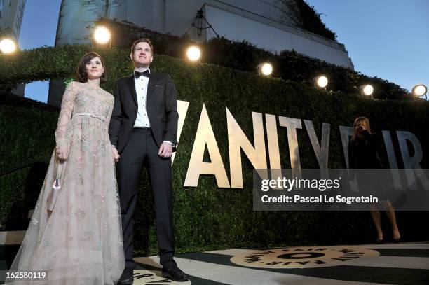 Actress Zooey Deschanel and Jamie Linden arrives at the 2013 Vanity Fair Oscar Party hosted by Graydon Carter at Sunset Tower on February 24, 2013 in...