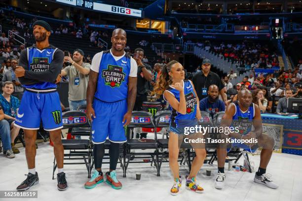 Matt James, Vernon Davis, Ashley Darby and Terrell Owens of Team Webull attend the Monster Energy BIG3 Celebrity Game at Capital One Arena on August...
