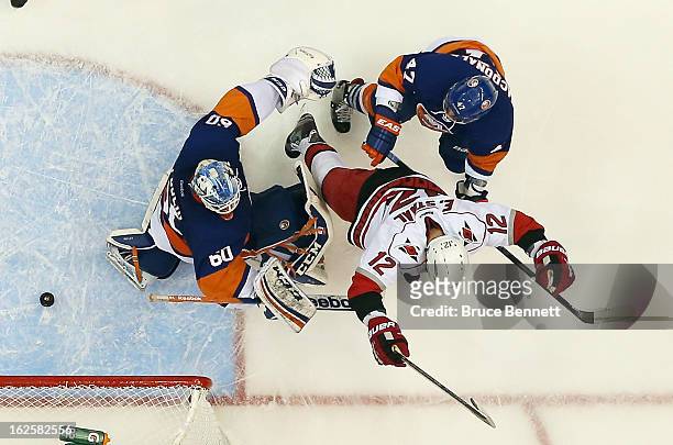 Eric Staal of the Carolina Hurricanes celebrates his second period goal against Kevin Poulin of the New York Islanders at the Nassau Veterans...