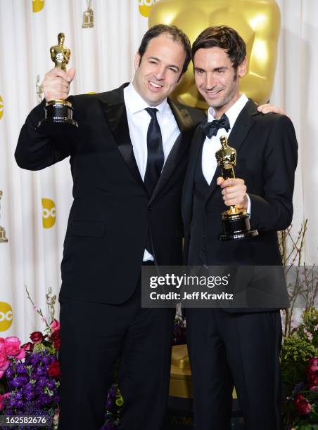 Filmmakers Simon Chinn and Malik Bendjelloulposes in the press room during the Oscars at Loews Hollywood Hotel on February 24, 2013 in Hollywood,...