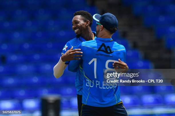 Khary Pierre and Faf Du Plessis of Saint Lucia Kings celebrate the dismissal of Andre Russell of Trinbago Knight Riders during the Men's 2023...