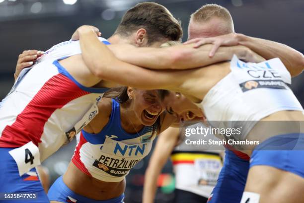 Matej Krsek, Tereza Petrzilkova, Patrik Sorm and Lada Vondrova of Team Czech Republic celebrate after winning the Bronze Medal in the 4x400m Mixed...