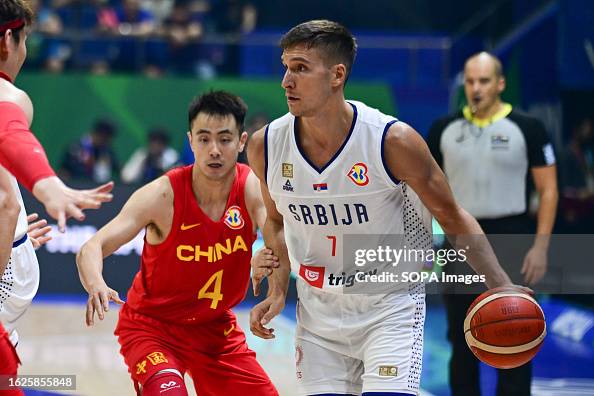 Jiwei Zhao of China men basketball team and Bogdan Bogdanovic of