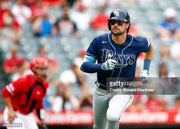 Josh Lowe of the Tampa Bay Rays hits a two-run single against the Los Angeles Angels during game one of a doubleheader at Angel Stadium of Anaheim on...