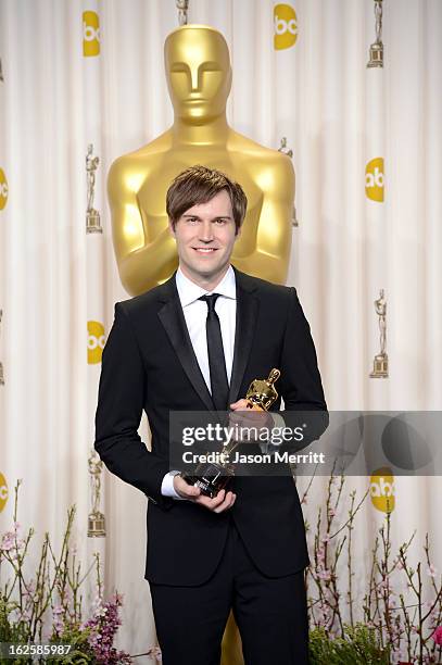 Filmmaker Shawn Christensen, winner of the Best Live Action Short Film award for "Curfew," poses in the press room during the Oscars held at Loews...