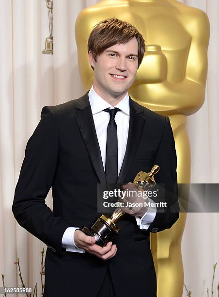 Filmmaker Shawn Christensen, winner of the Best Live Action Short Film award for "Curfew," poses in the press room during the Oscars held at Loews...