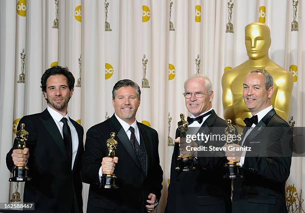 Bill Westenhofer, Guillaume Rocheron, Erik-Jan De Boer and Donald R. Elliott pose in the press room during the Oscars at the Loews Hollywood Hotel on...