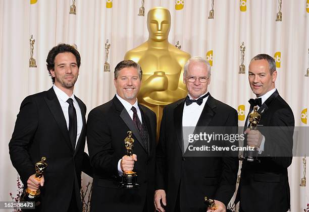 Bill Westenhofer, Guillaume Rocheron, Erik-Jan De Boer and Donald R. Elliott pose in the press room during the Oscars at the Loews Hollywood Hotel on...