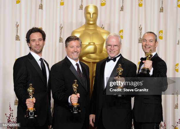 Bill Westenhofer, Guillaume Rocheron, Erik-Jan De Boer and Donald R. Elliott pose in the press room during the Oscars at the Loews Hollywood Hotel on...