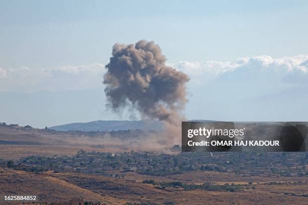 Smoke billows from a reported Russian airstrike on the village of Sfuhen in Syria's rebel-held northwestern Idlib province, on August 26, 2023.