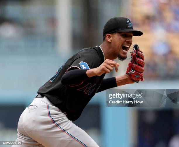 Eury Perez of the Miami Marlins reacts to a strikeout of Austin Barnes of the Los Angeles Dodgers during the third inning at Dodger Stadium on August...
