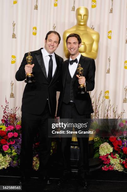 Malik Bendjelloul and Simon Chinn pose in the press room during the Oscars at the Loews Hollywood Hotel on February 24, 2013 in Hollywood, California.