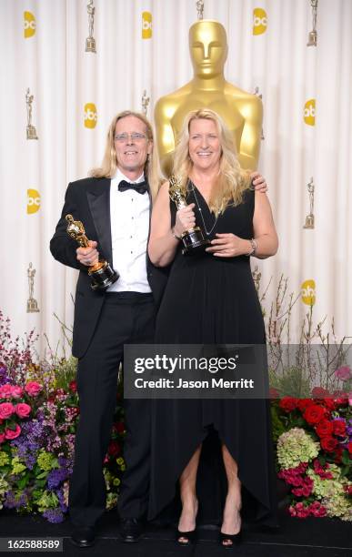 Sound editors Per Hallberg and Karen Baker Landers, winners of the Best Sound Editing award for "Skyfall," pose in the press room during the Oscars...