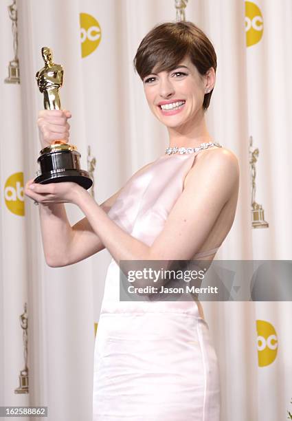 Actress Anne Hathaway, winner of the Best Supporting Actress award for "Les Miserables," poses in the press room during the Oscars held at Loews...