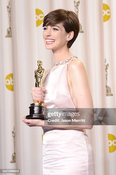 Actress Anne Hathaway, winner of the Best Supporting Actress award for "Les Miserables," poses in the press room during the Oscars held at Loews...