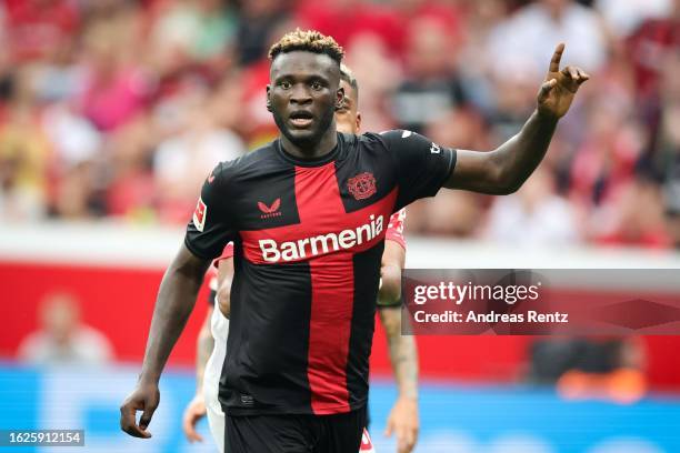 Victor Boniface of Bayer 04 Leverkusen gestures during the Bundesliga match between Bayer 04 Leverkusen and RB Leipzig at BayArena on August 19, 2023...