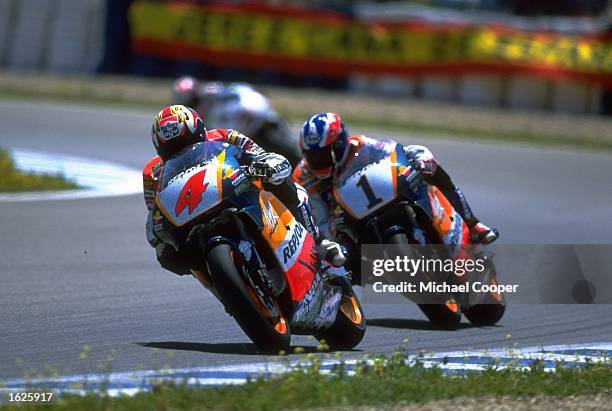 Alex Criville of Spain is under pressure from Mick Doohan of Australia during the Spanish Motorcycle Grand Prix in Jerez, Spain. \ Mandatory Credit:...