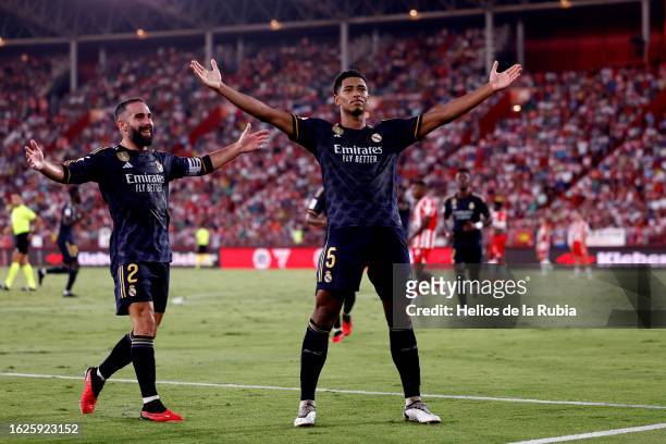 Jude Bellingham player of Real Madrid celebrates his goal with teammate Daniel Carvajal during the LaLiga EA Sports match between UD Almeria and Real...