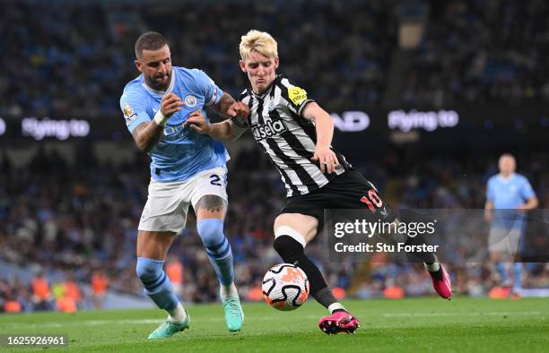 Manchester City player Kyle Walker challenges Anthony Gordon of Newcastle during the Premier League match between Manchester City and Newcastle...