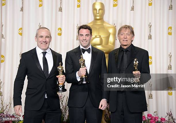 Sound engineers Simon Hayes, Mark Paterson and Andy Nelson, winners of the Best Sound Mixing award for "Les Miserables," pose in the press room...