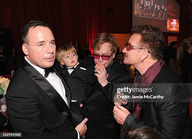 David Furnish, Zachary Furnish-John, Sir Elton John and singer Bono attend the 21st Annual Elton John AIDS Foundation Academy Awards Viewing Party at...