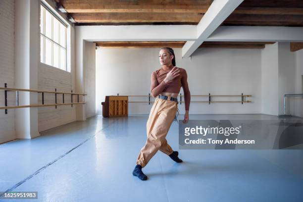 young dancer rehearsing in ballet studio - dance rehearsal stock pictures, royalty-free photos & images