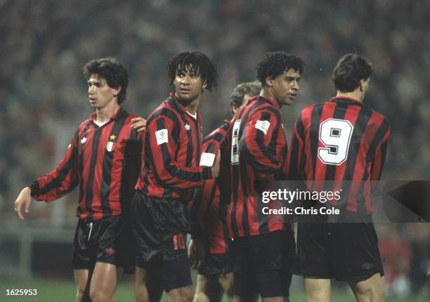 Milan Players Demetrio Albertini, Ruud Gullit, Frank Rijkaard and Marco Van Basten form a wall in the European Cup match against PSV Eindhoven. AC...