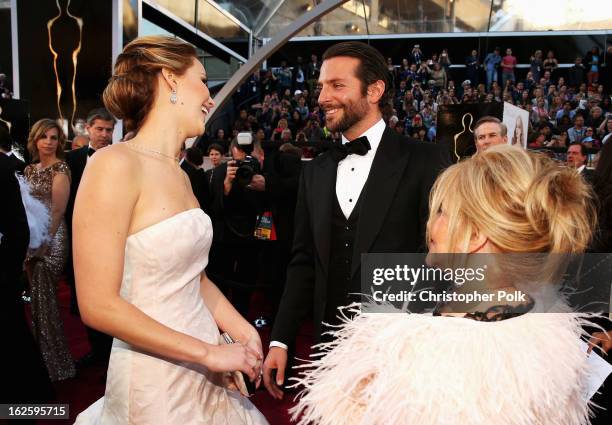 Actors Jennifer Lawrence, Bradley Cooper, and Gloria Cooper arrive at the Oscars held at Hollywood & Highland Center on February 24, 2013 in...