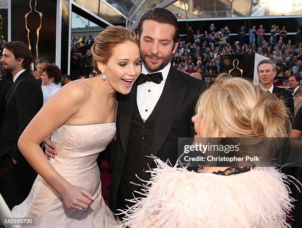 Actors Jennifer Lawrence, Bradley Cooper, and Gloria Cooper arrive at the Oscars held at Hollywood & Highland Center on February 24, 2013 in...