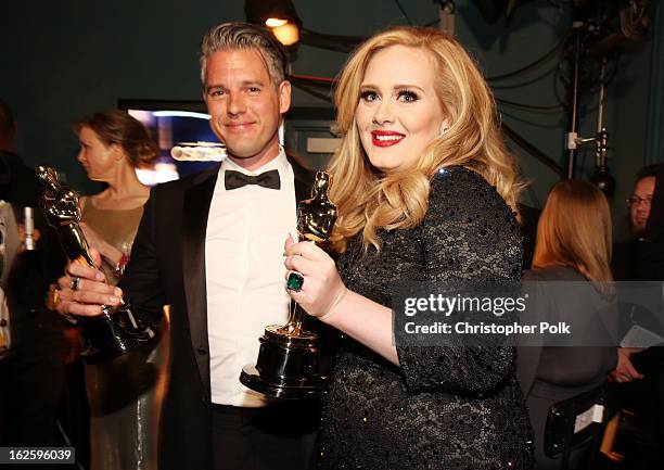 Songwriter Paul Epworth and singer Adele, winners of the Best Original Song award for "Skyfall," backstage during the Oscars held at the Dolby...