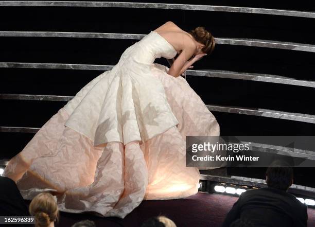 Actress Jennifer Lawrence reacts after winning the Best Actress award for "Silver Linings Playbook" during the Oscars held at the Dolby Theatre on...