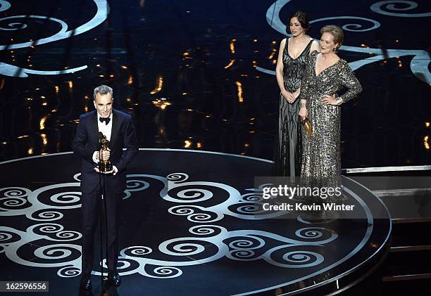 Actor Daniel Day-Lewis accepts the Best Actor award for "Lincoln" from presenter Meryl Streep onstage during the Oscars held at the Dolby Theatre on...