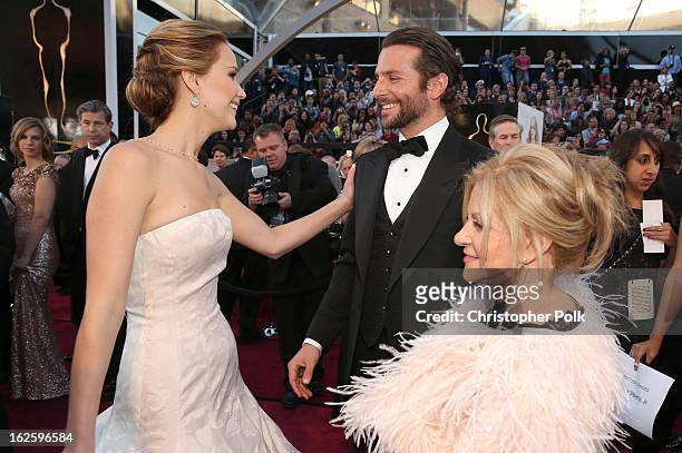 Actors Jennifer Lawrence, Bradley Cooper, and Gloria Cooper arrive at the Oscars held at Hollywood & Highland Center on February 24, 2013 in...